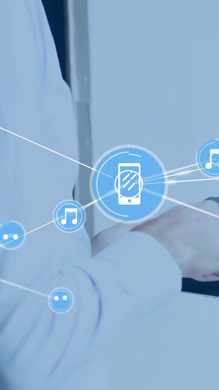 Video verticale: Un uomo tocca il telefono facendo espandere i nodi per mostrare collegamenti musicali, mentre la telecamera si allontana.