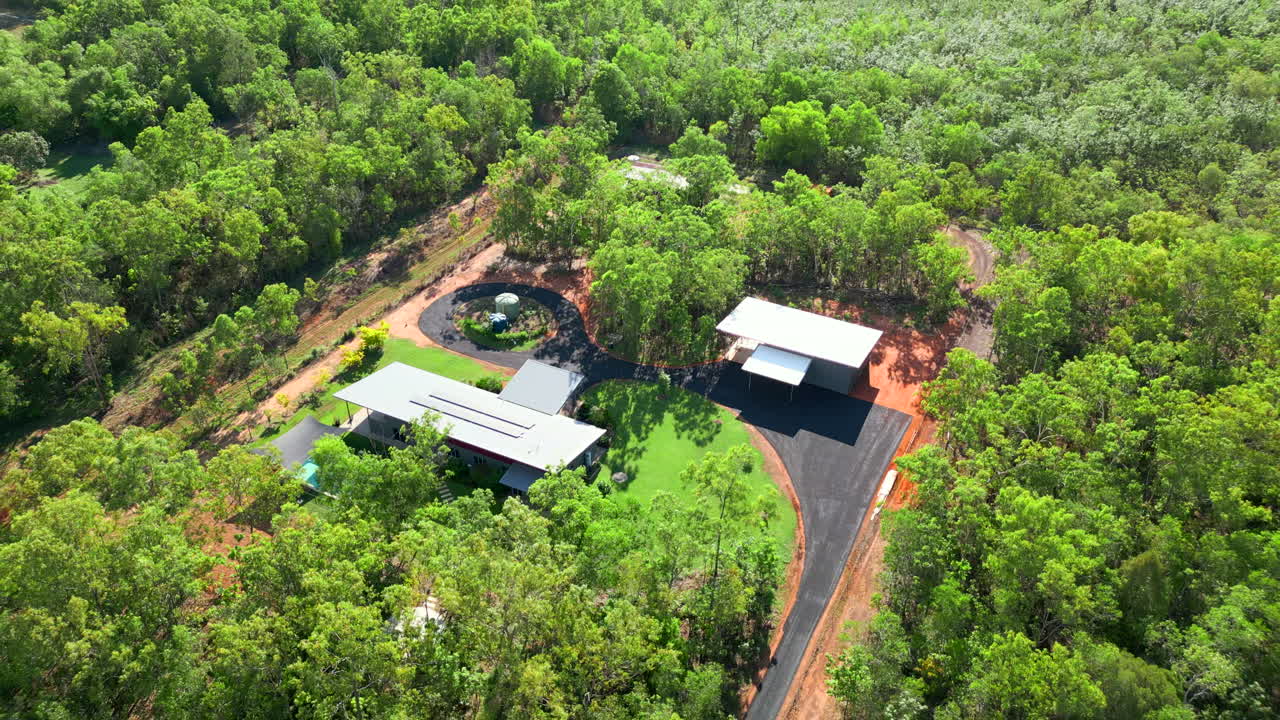 Modern rural house with bitumen driveways and natural bush land surrounds