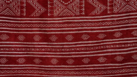 red tunisian patterned fabric, detailed traditional design close-up