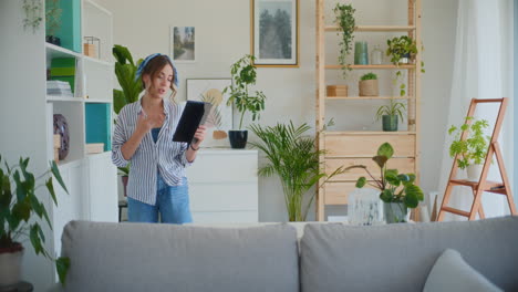 woman having video call on tablet at home