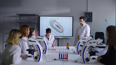 students in a biology lab learning about bacteria.