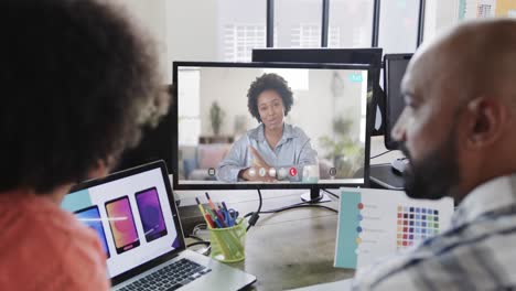 african american business people on video call with african american female colleague on screen