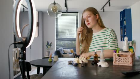 teenage girl doing hair tutorial