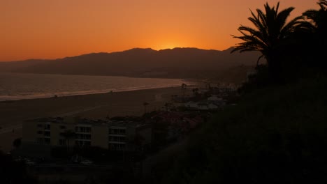 orange sky sunset by the beach in palisades park santa monica