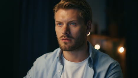 Serious-man-watching-pc-at-home-closeup.-Focused-freelancer-reading-computer