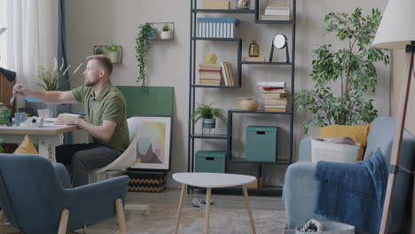 man working in a living room