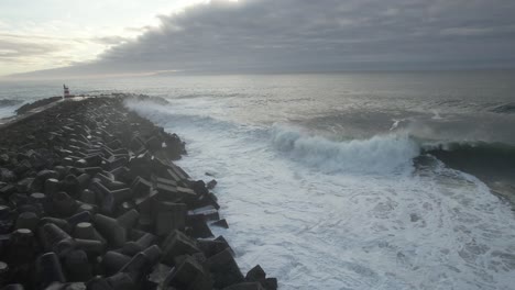 stormy dangerous waves crashing on the rocks