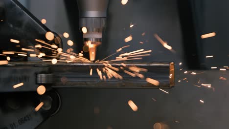 cnc laser cutting of metal, modern industrial technology making industrial details. shot on super slow motion camera 1000 fps