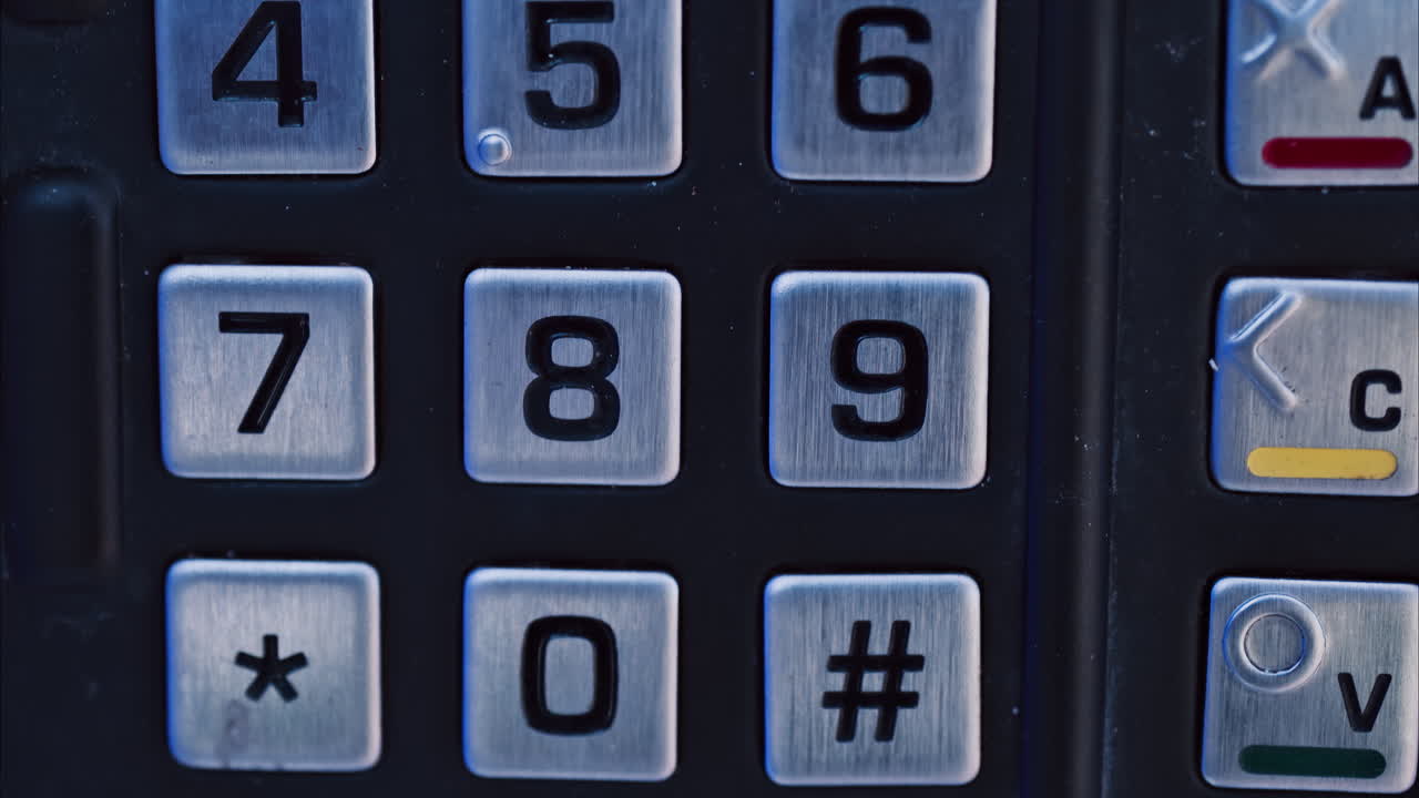 Close up numbered buttons on a machine