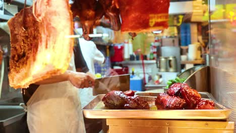 chef skillfully prepares crispy pork in kitchen