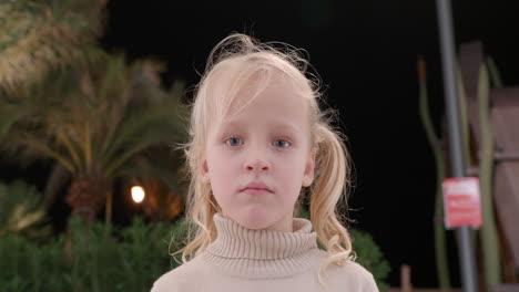 girl with pigtails gazing upwards