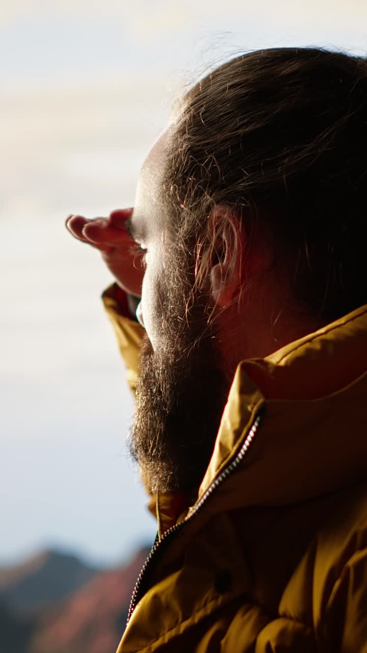 Bearded Man in Yellow Jacket Looking Out at the Horizon