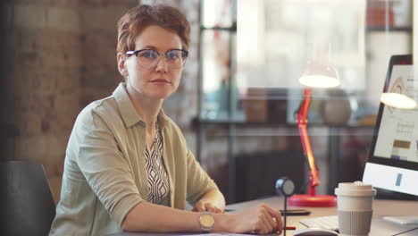 woman working at a desk in a modern office