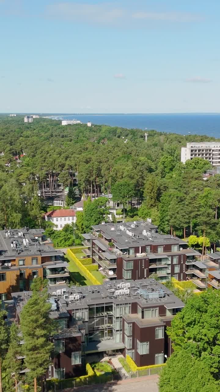 Arial view of Jurmala beach, Latvia with lush greenery and calm vibe, vertical