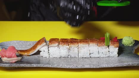 preparing unagi sushi