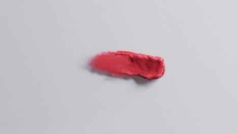 video of lipstick smudge with copy space on white background