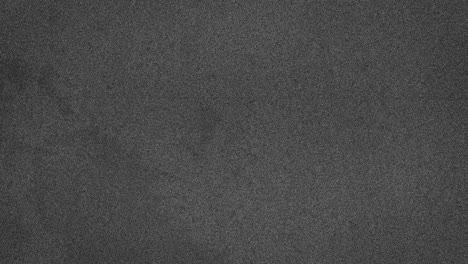 animation of grey marks and specks moving on seamless loop on grey background