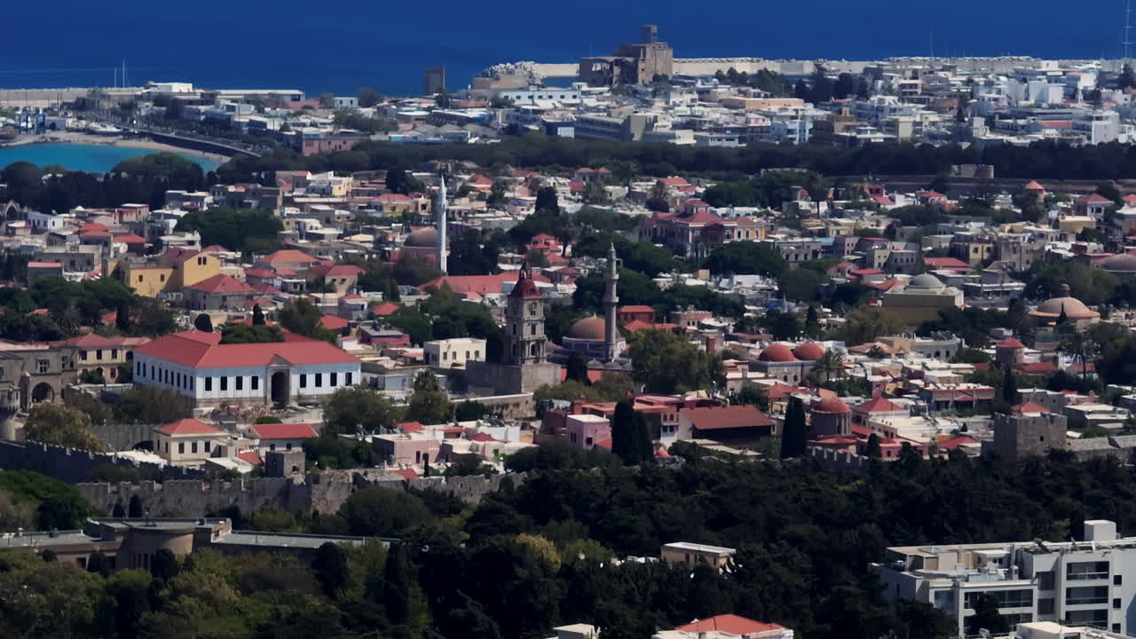Telephoto drone shot around the old town of Rhodes, Greece, sunny, summer day