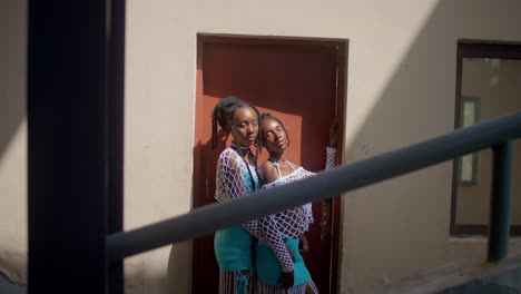 Two Stylish African Women Posing in Crochet Outfits