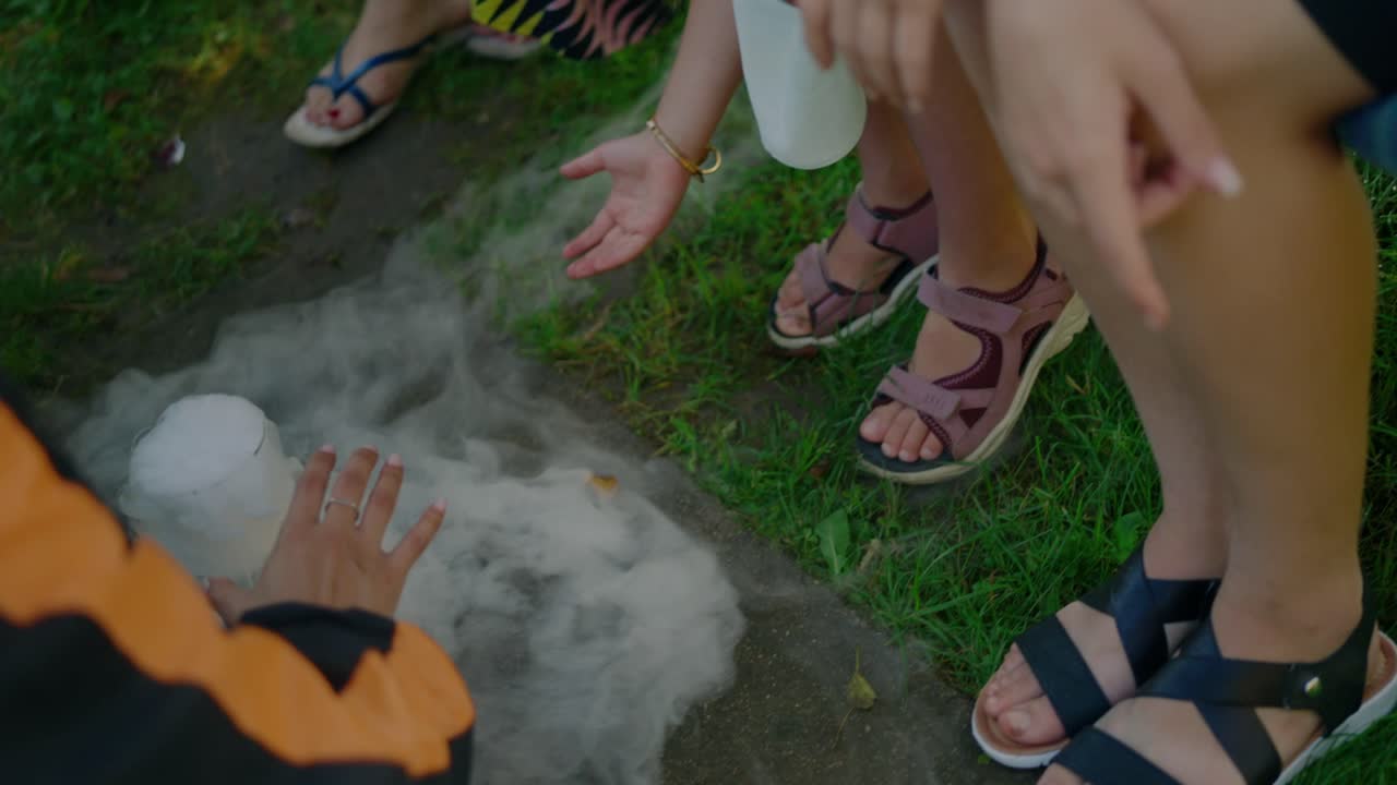 Kids playing with dry ice outdoors