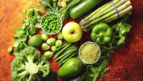 Fresh-green-vegetables-and-fruits-assortment-placed-on-a-rusty-metal