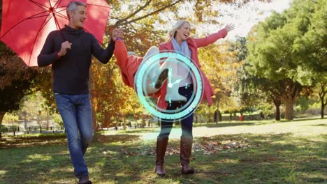 reloj digital de neón azul contando contra la familia caucásica jugando en el parque