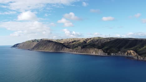 tracking shot of a coastal wind farm