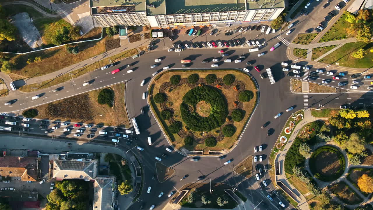 Aerial drone view of Chisinau at sunset. Vertical, hypelapse view of a roundabout intersection. Moldova