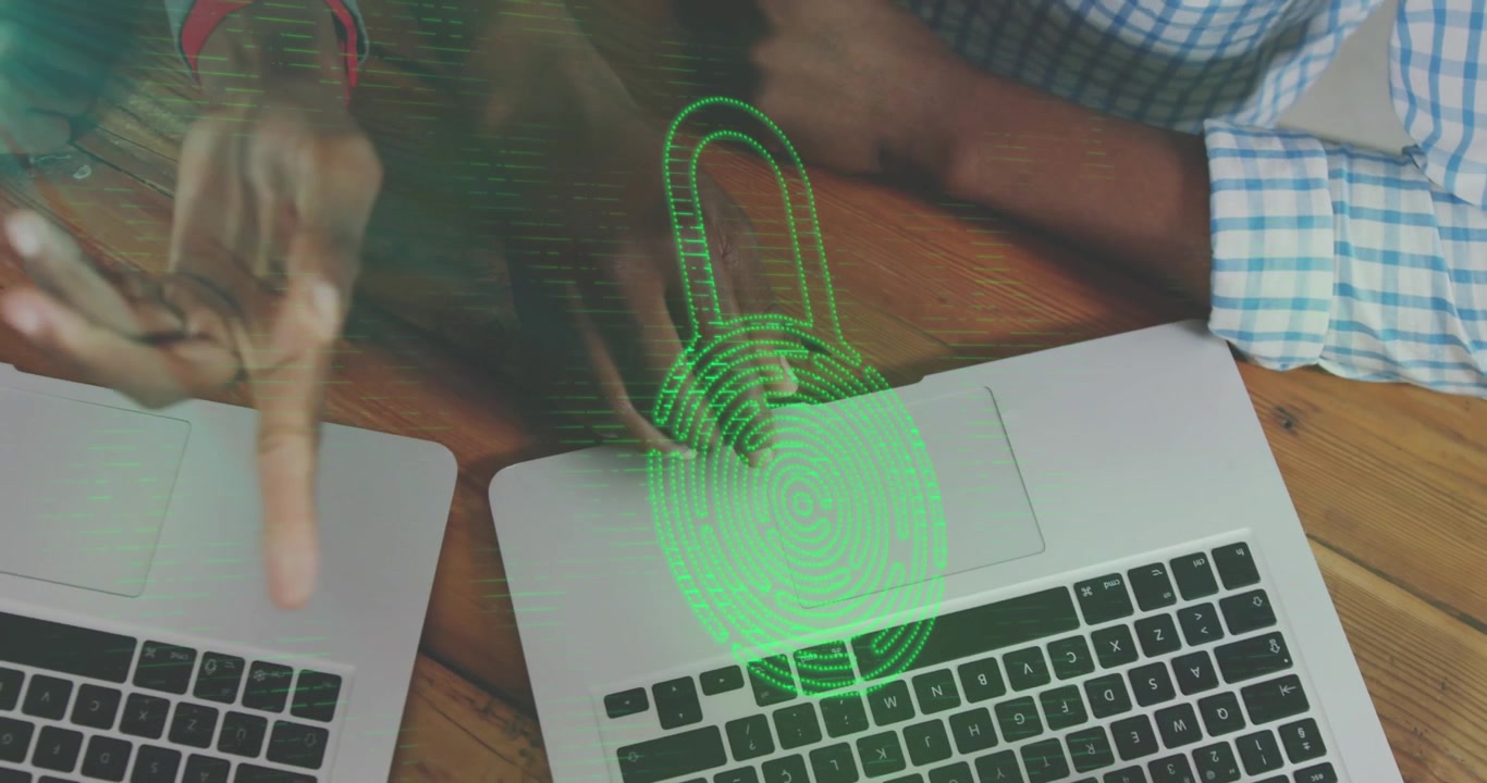 Animation of padlock icon and data processing over diverse people using laptops