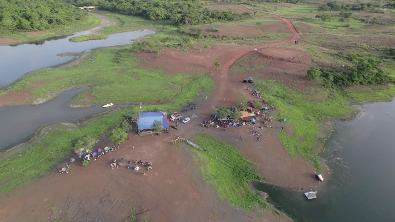 Aerial zenith view tilt up reveal camping in tropical nature, Rio Verde Venezuela