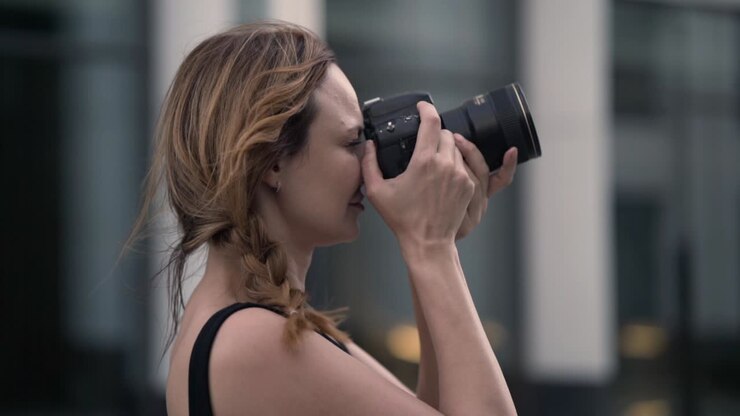 Woman taking pictures in the city