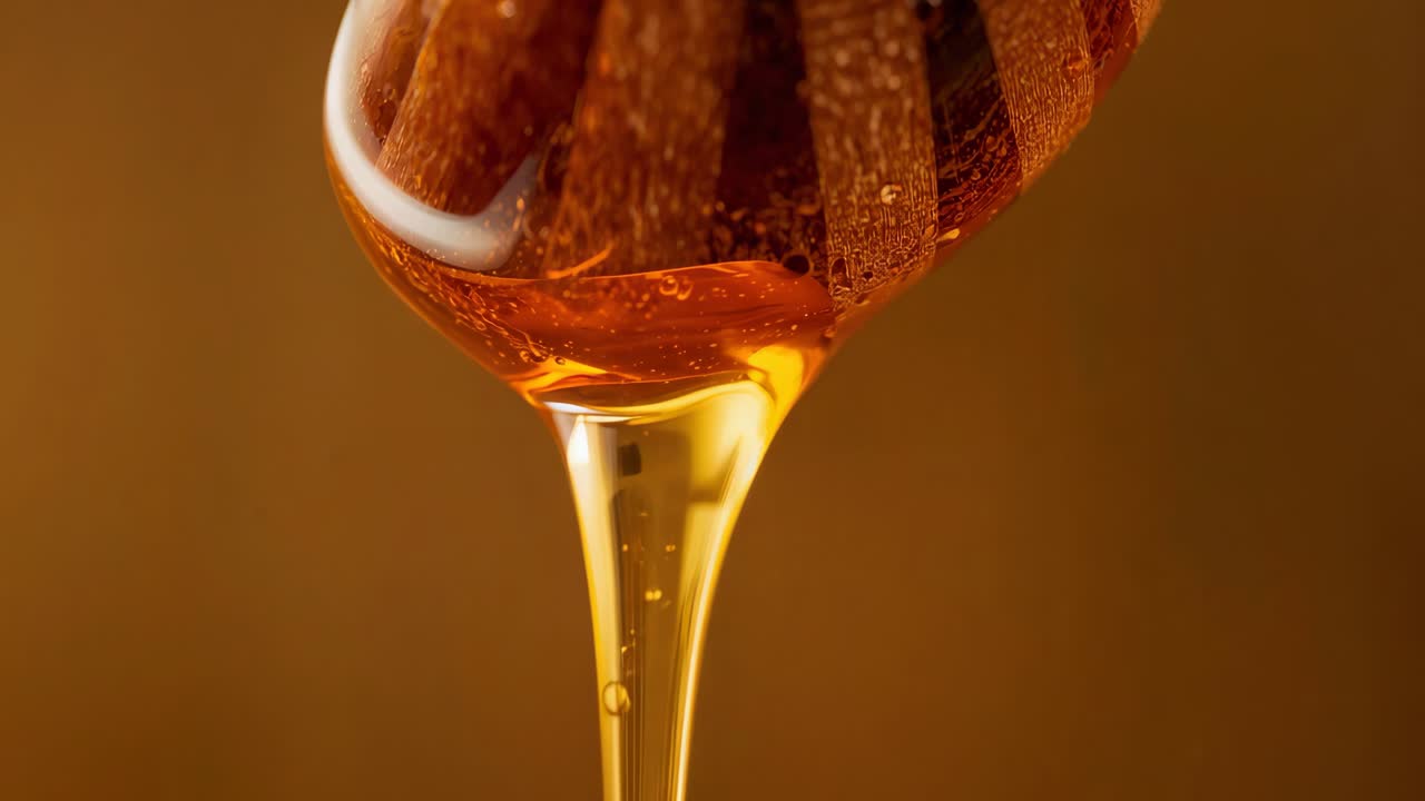 Close-up of dripping honey