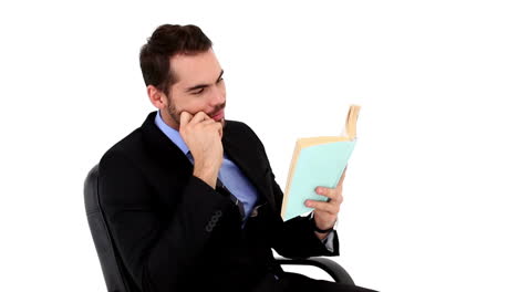 young businessman reading a book
