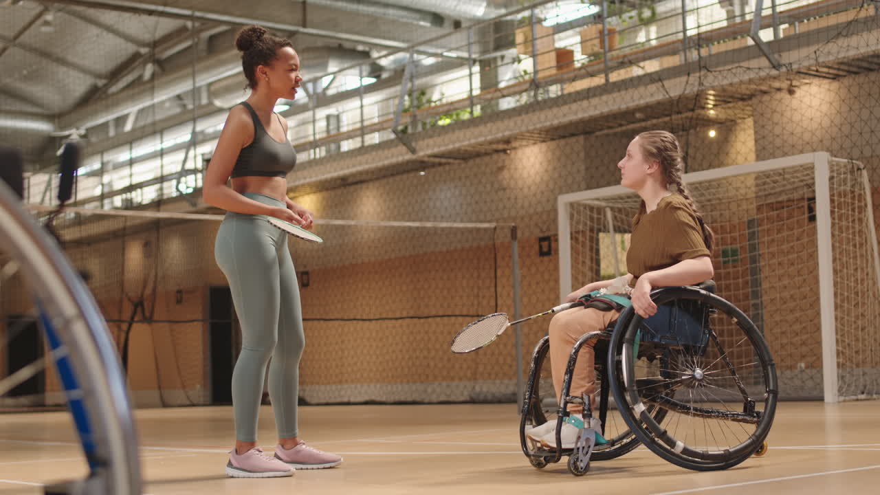 Diverse Athletes Chatting in Indoor Court