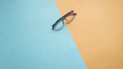 Hand-pick-a-eyeglass-on-table