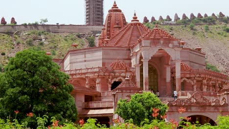 artistic-red-stone-jain-temple-at-morning-from-unique-angle-video-is-taken-at-Shri-Digamber-Jain-Gyanoday-Tirth-Kshetra,-Nareli-Jain-Mandir,-Ajmer,-Rajasthan,-India-an-Aug-19-2023.