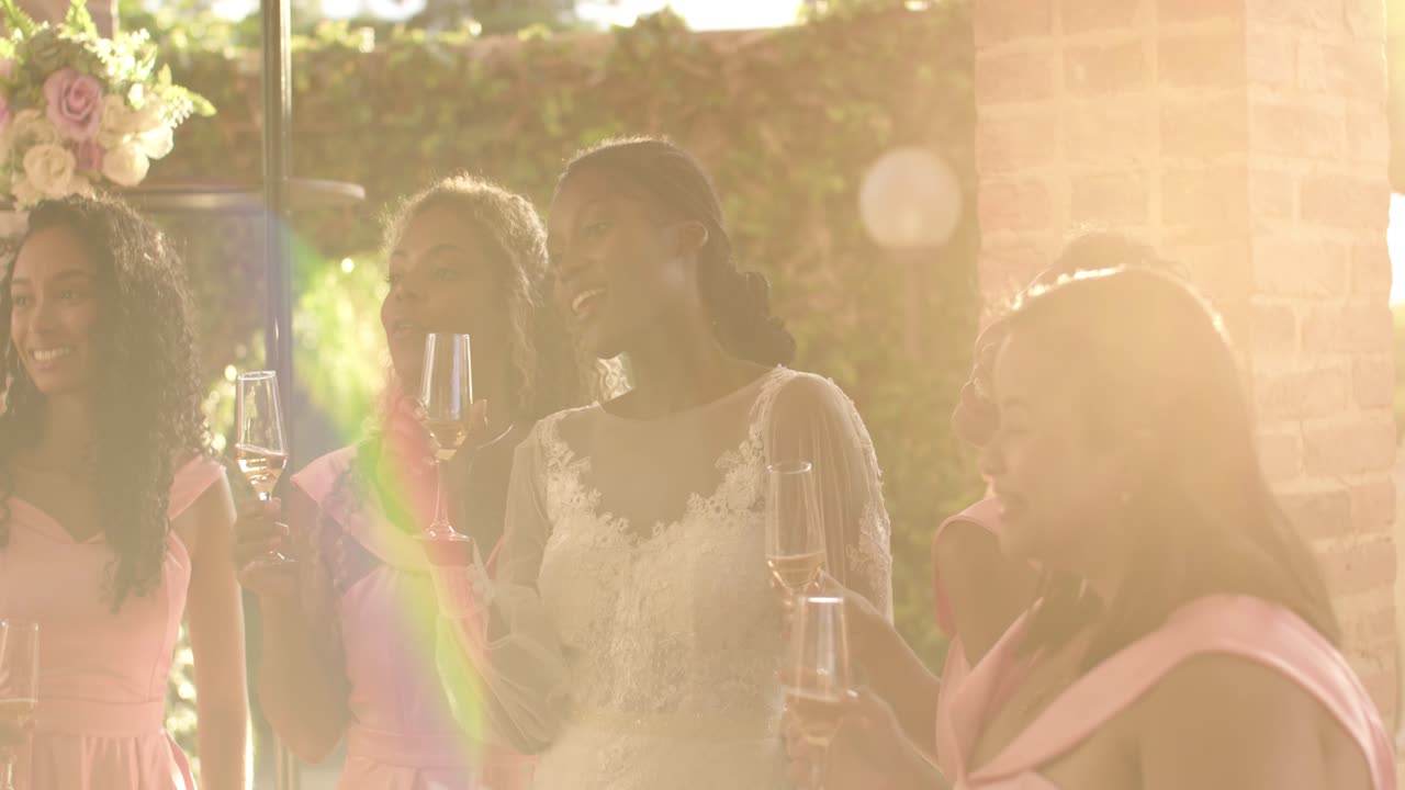 Women celebrating a wedding with a champagne toast