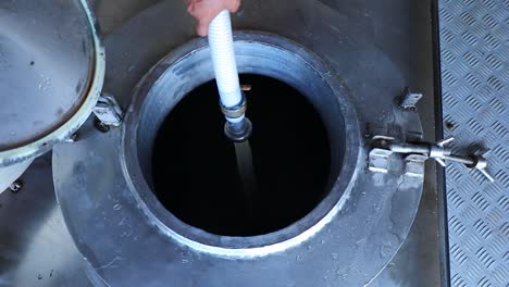 cooking milk in a copper tank for cheese production