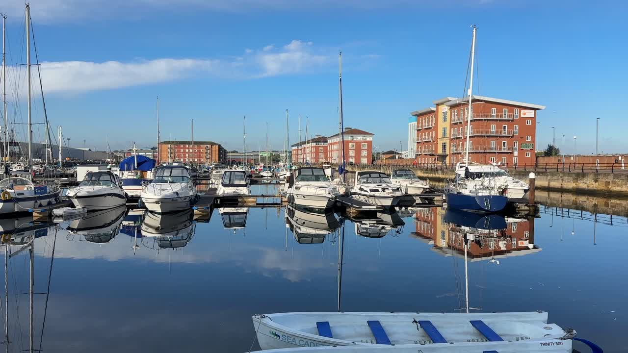 Aerial drone video of Hartlepool North East England UK coastal town with marina, harbour, and seaside urban landscape