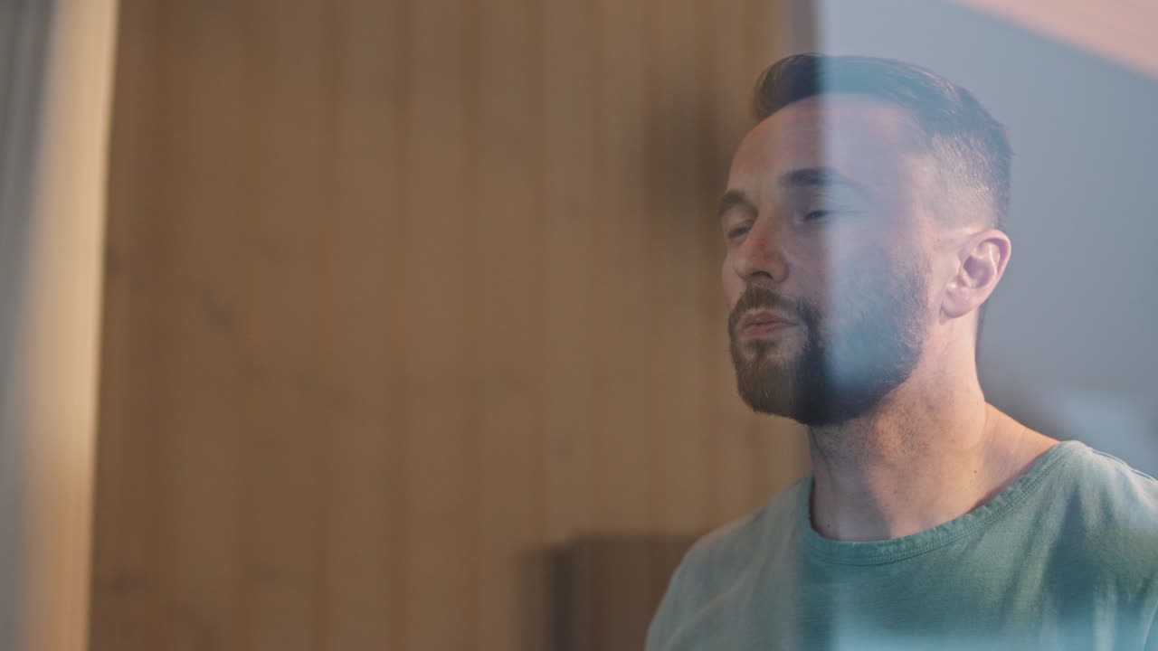 Thoughtful Man With Hot Tea Looking At Window