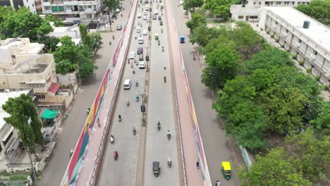 vehicles exiting through the bridge within the urban city