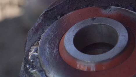 electrode touching a piece of metal and lighting producing sparks and smoke - close shot slowmotion