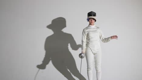 female foil fencer in action