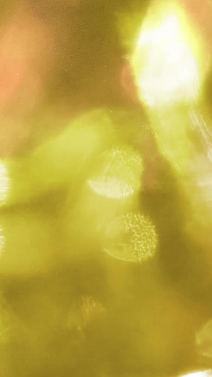 Abstract Light Leaks and Bokeh Transitions on Dark Background
