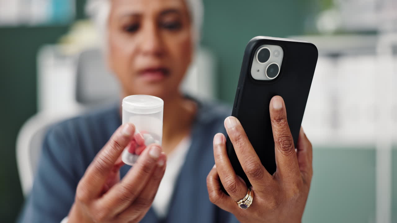 Senior woman using smartphone to manage medication
