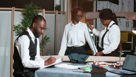 client posing for the tailor