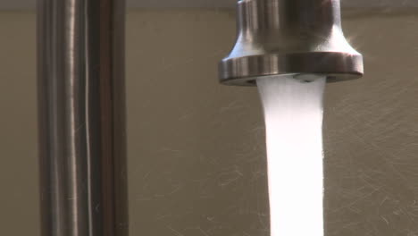 close up of water turning on and off from a faucet in oak view california