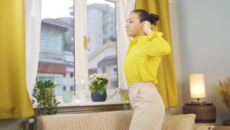 the young woman who opens the curtains yawns and relaxes.