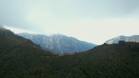 Miradouro-Eira-do-Serrado-aerial-view-towards-Pico-Grande-mountain-ridge-summit-in-Madeira,-Portugal