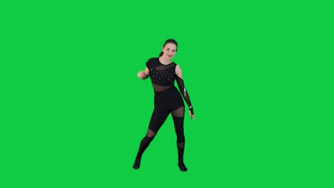 Professional-female-dance-performer-dancing-slow-motion-in-front-of-the-green-screen-in-black-outfit